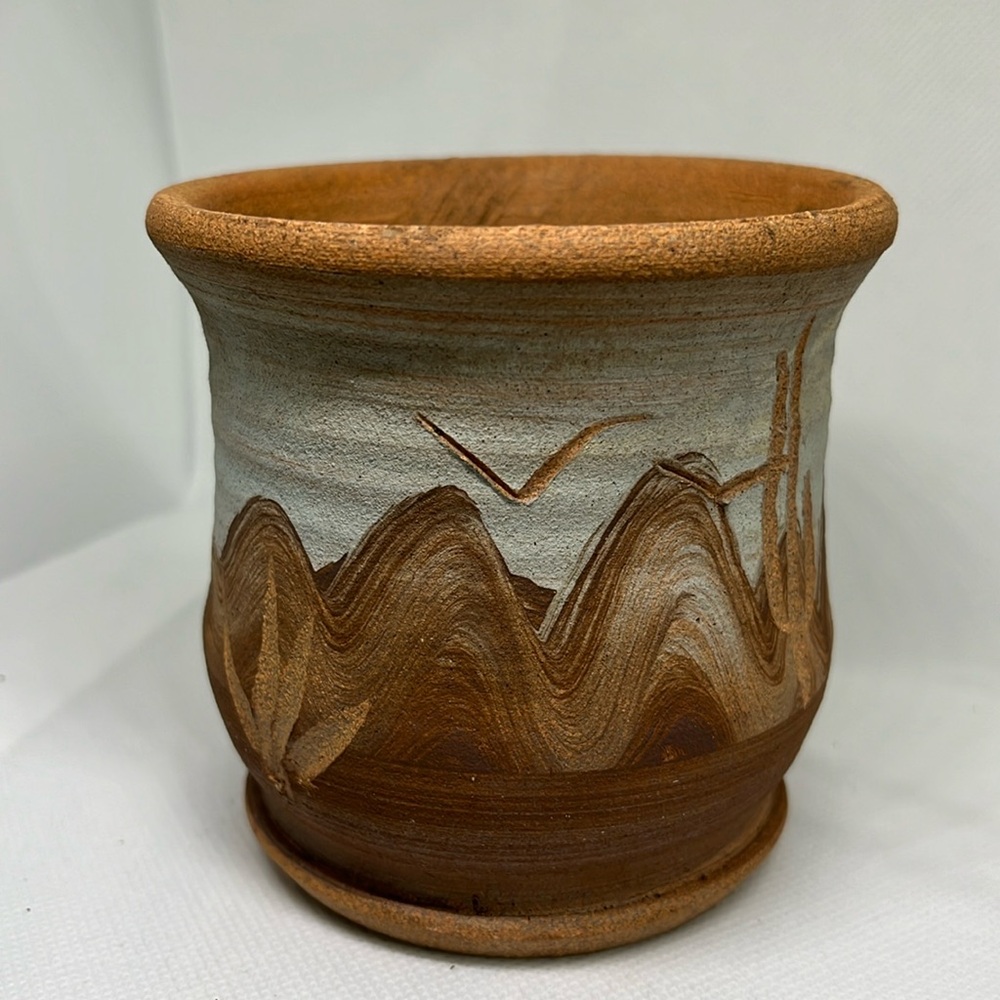 Pottery planter desert scene with cactuses and mountains